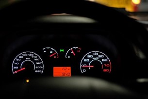 A picture of a car dashboard at night